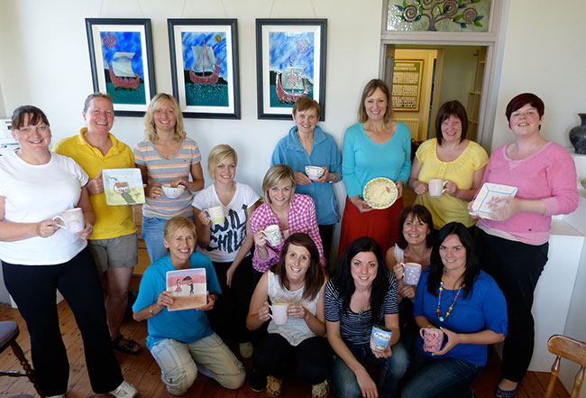crafty hen party group with their painted pottery at a party in Northern Ireland